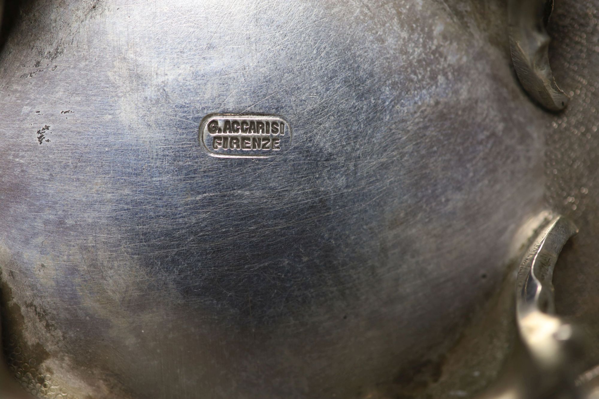 A pair of Italian white metal two handled sweetmeat bowls, by G Accarisi, with figural handles, dia. 85mm, 8oz.